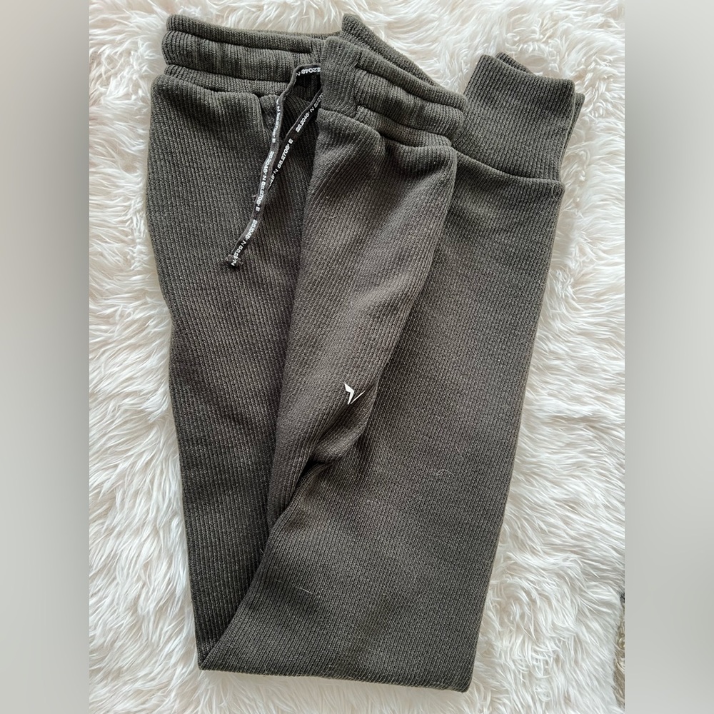 Olive green ribbed sweatpants.